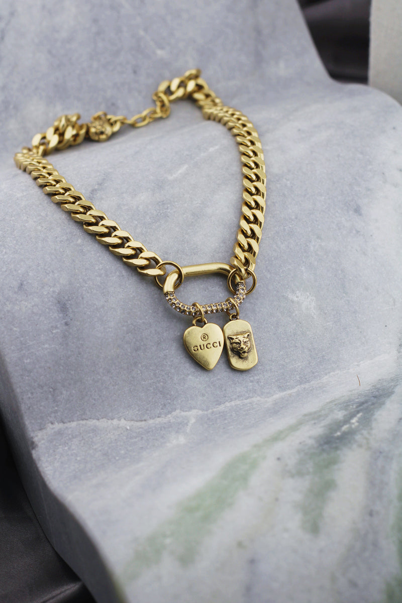 SILVERHEART PANTHER TAG NECKLACE IN GOLD by RAËLIV