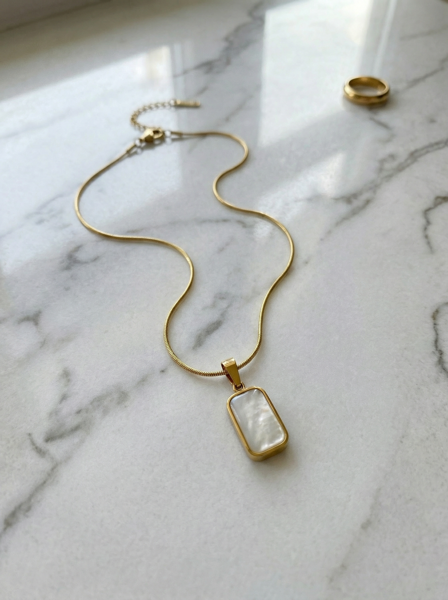 THE GEMINI SHELL NECKLACE IN GOLD (REVERSABLE, WATERPROOF, 18K GOLD PL by RAËLIV