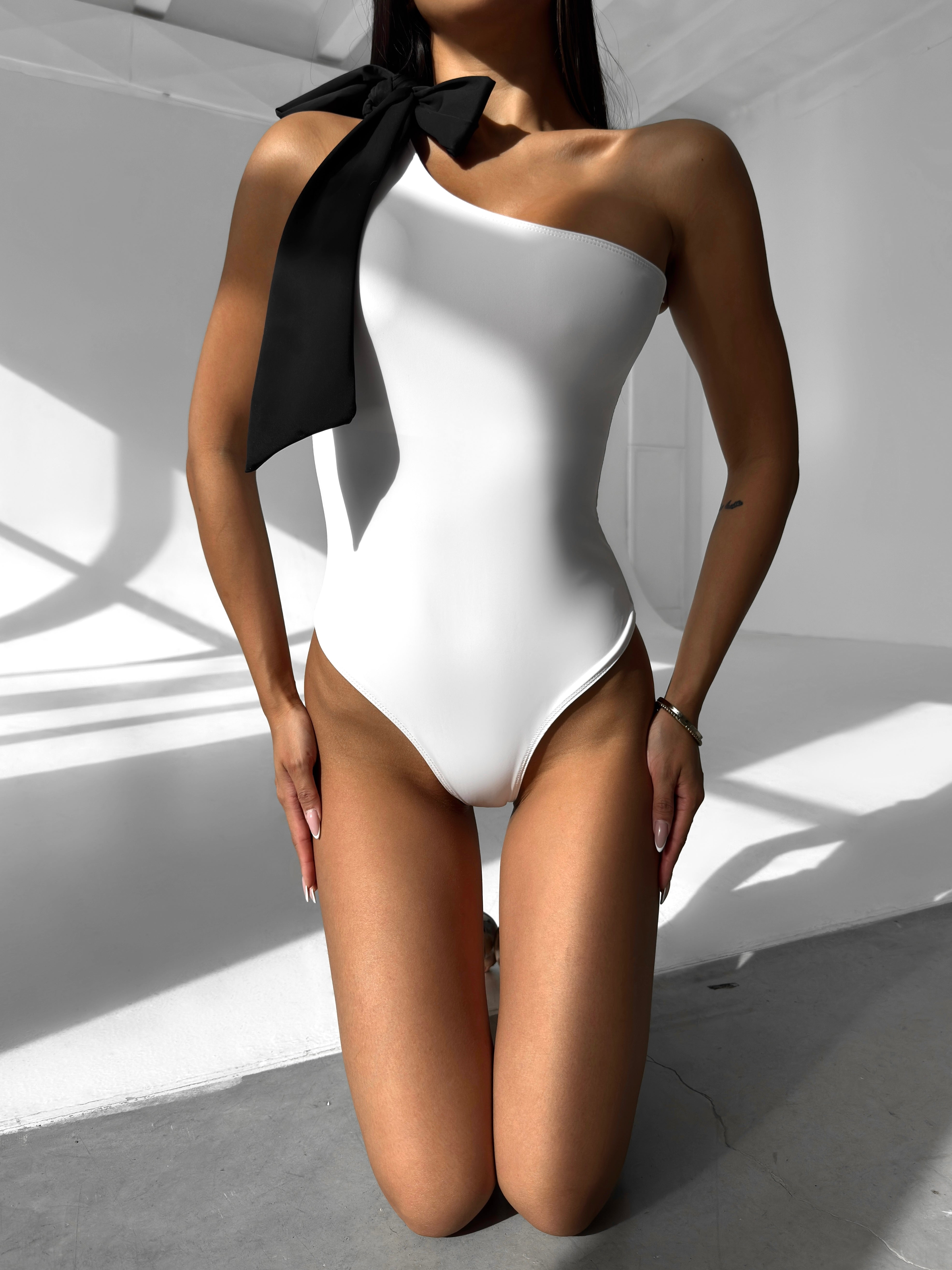 Muse Bow Asymmetric One Piece in White by MERIEL