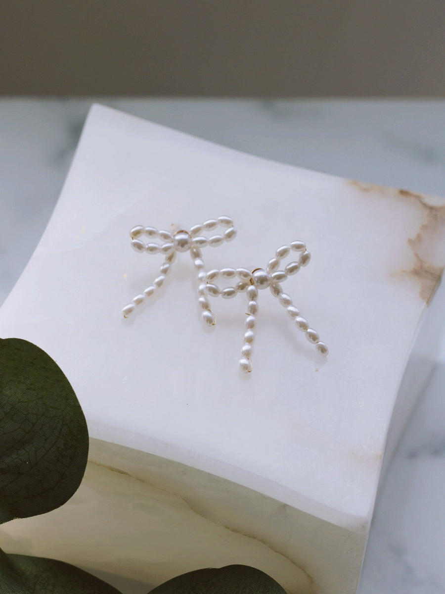 PEARL-STUDDED BOW EARRINGS by RAËLIV