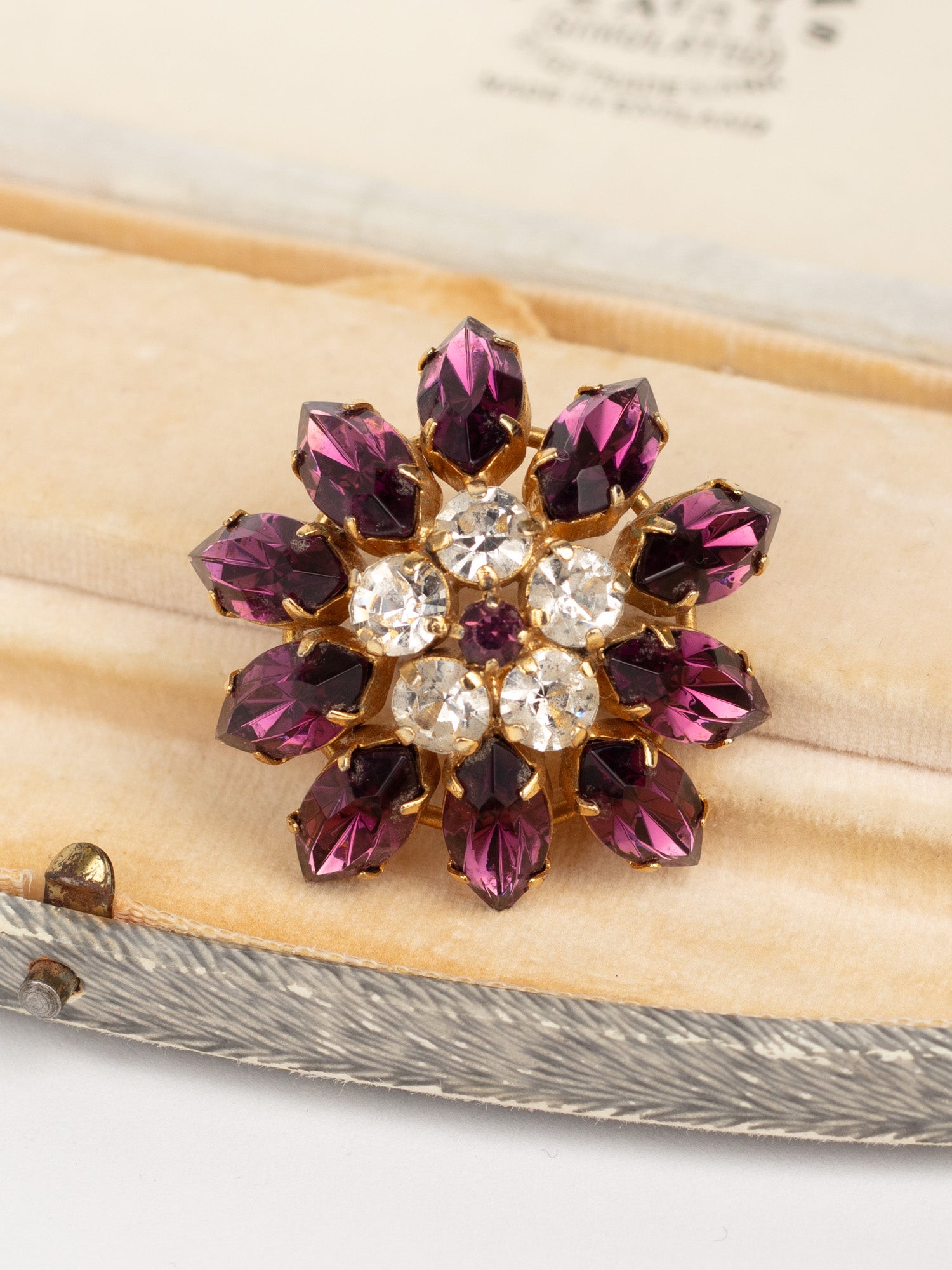 Vintage 60s Purple and Clear Rhinestone Starburst Brooch by Northern Grip