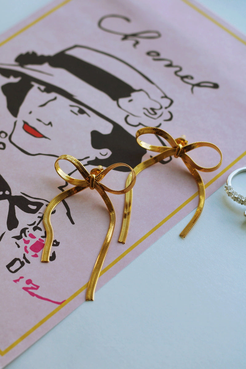BRIT BOW EARRINGS IN GOLD (WATERPROOF & 18K GOLD PLATED) by RAËLIV